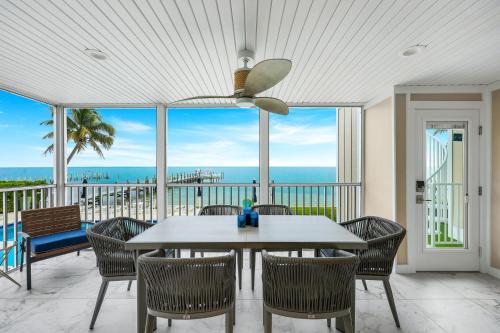 a dining room with a table and chairs at Captiva Hide A Way 1B in Captiva