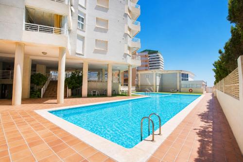 Apartment on the beach with parking and pool