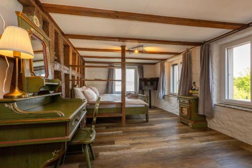 a bedroom with a bed and a desk with a dresser at Charming Swiss Lake View studio apartment in Wädenswil