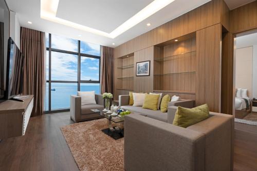 a living room with a couch and a television at The Nalod Da Nang in Danang