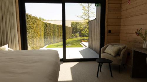 Llit o llits en una habitació de Serenitijd