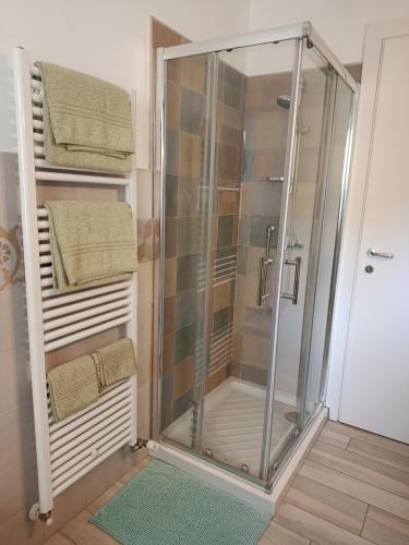 a shower with a glass enclosure in a bathroom at Chez Bonjour in Villar Pellice
