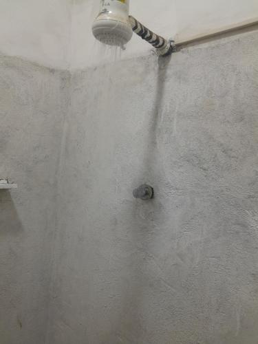 a shower with a light attached to a wall at Amazing Lalibela Home stay in Lalibela
