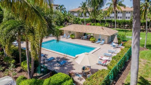 an aerial view of a swimming pool and a resort at Compass Point 221 in Sanibel