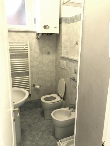 a small bathroom with a toilet and a sink at Monterosso - Apartment in Monterosso al Mare