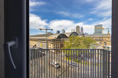 a view of a city skyline from a balcony at Hotel Continental Frankfurt in Frankfurt