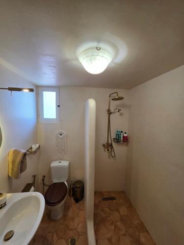 a bathroom with a sink and a toilet at Sherlock Home in Komotini