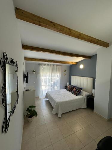 a bedroom with a bed and a window in a room at Casa Atalaya Playa R&R in Aguadulce