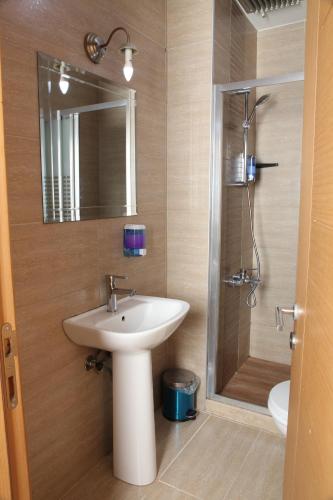 a bathroom with a sink and a shower at garden hill hotel in Istanbul