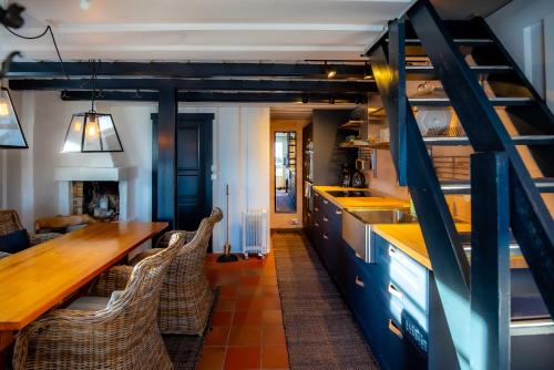 a kitchen with blue cabinets and a wooden counter top at Trysilfjellet Nord 1111B in Trysil