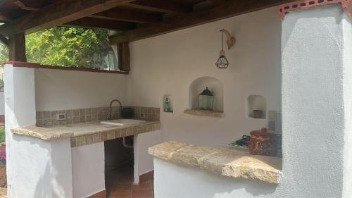 a kitchen with a counter and a sink in a room at Addaura Paradise House in Palermo