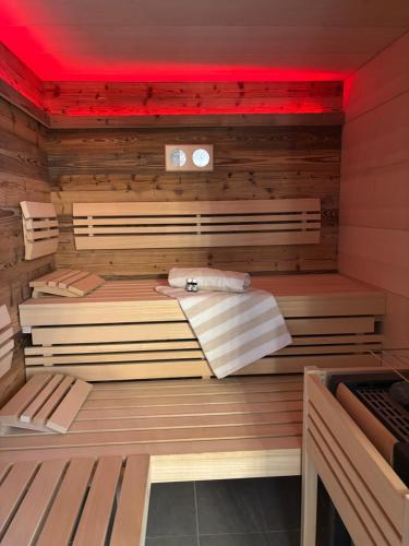a sauna with wooden walls and a red ceiling at Gasthaus Kerber in Fürstenstein