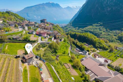 an aerial view of a village in a valley with mountains at Private Green Oasis - Terrace - Happy Rentals in Tenno