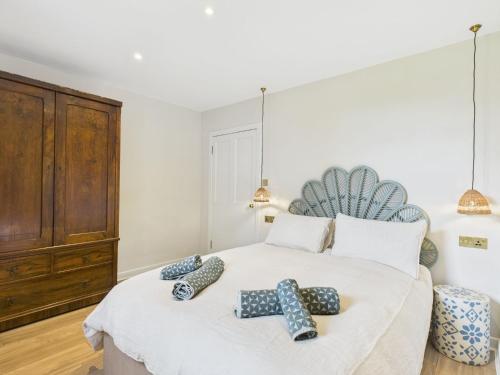 a bedroom with a bed with two ties on it at Laura's House in Coupar Angus