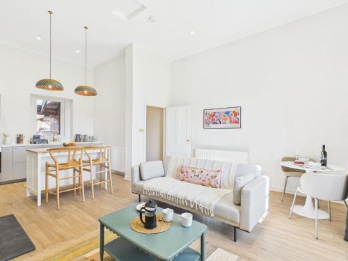 a living room with a couch and a table at Laura's House in Coupar Angus