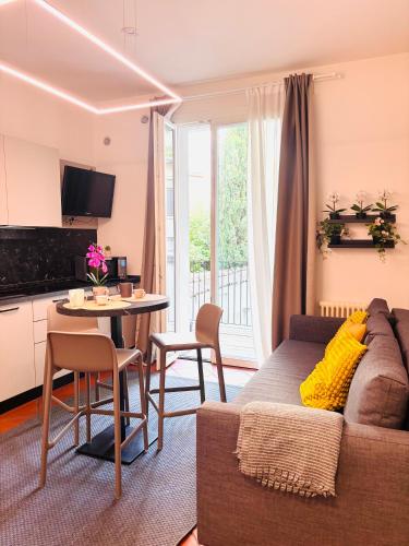 a living room with a couch and a table at Private Terrace Cozy Flat near Vicenza Center in Vicenza