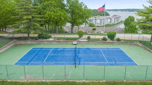 an overhead view of a tennis court with an american flag at By The Lake Resort Access in Lake Ozark