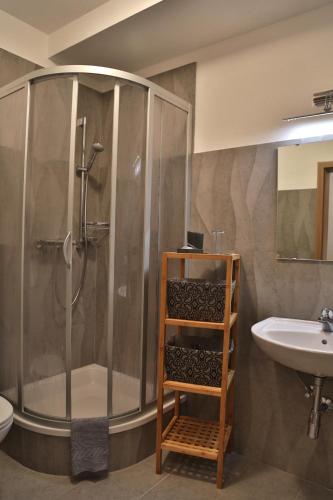 a bathroom with a shower and a sink at Ferienhaus Viktoria in Abfaltersbach