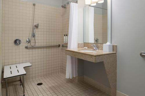 a bathroom with a sink and a shower at TownePlace Suites Redding in Redding