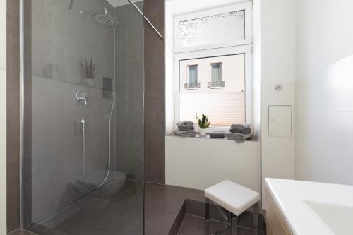 a bathroom with a shower with a glass door at Hafenblick in Waren