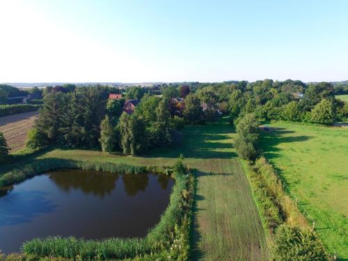 an aerial view of a pond in a field at Ferienhaus Schlei in Rabenkirchen-Faulück