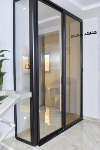 a sliding glass door in a room at Impavid Hotel in Gabès