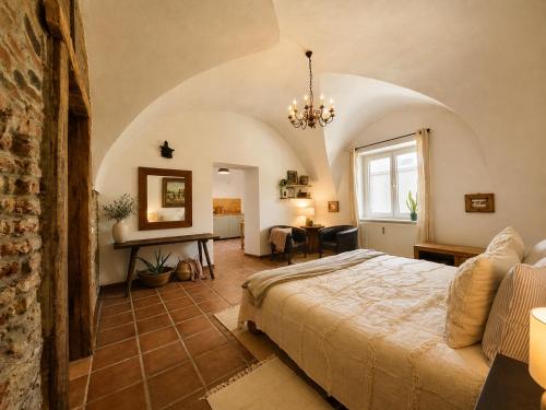 a bedroom with a large bed in a room at Brick House in Fürstenfeld