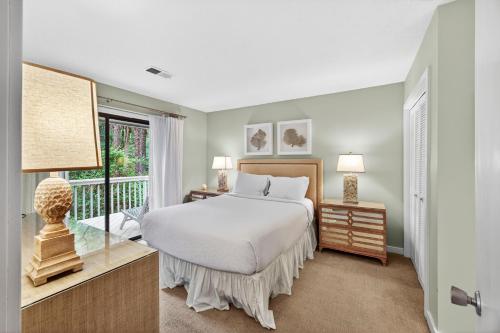 a bedroom with a bed and a window at IC106: 106 Inlet Cove in Kiawah Island
