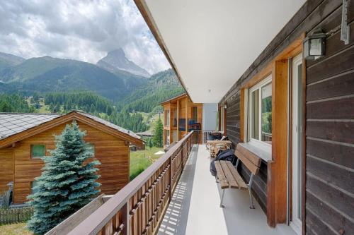 a balcony with a view of the mountains at Matterhorn Panorama Apartment in Zermatt