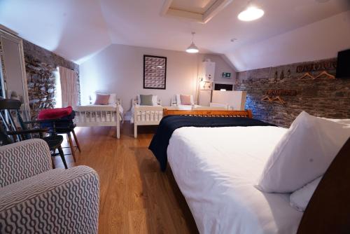 a bedroom with a bed and a living room at Rockfield House in Kells