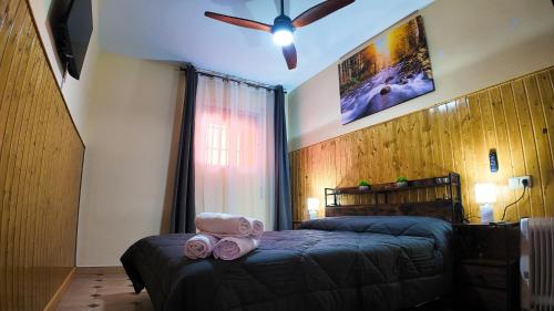 a bedroom with a bed with a stuffed animal on it at Ruralux Valentín in Calasparra
