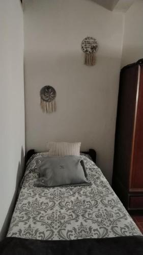 a bedroom with a bed with a pillow on it at Magda in Resistencia
