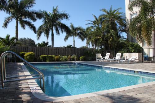 a swimming pool with a stairway leading to a resort at Crystal Bay Historic Hotel in St Petersburg