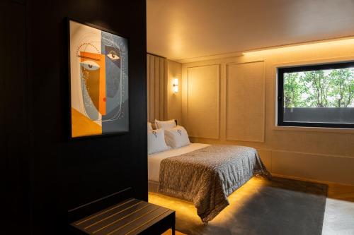 En eller flere senge i et værelse på Palatial Suites