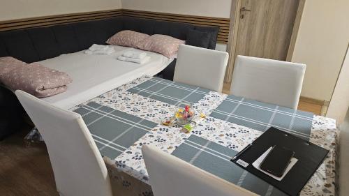 a dining room table with a table cloth on it at Apartment Sara in Koper