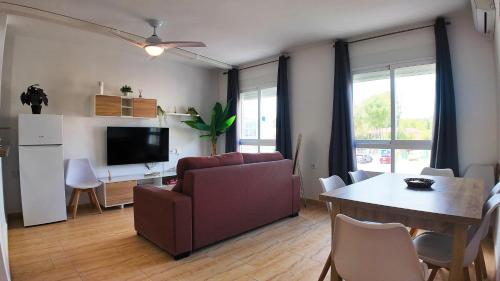 a living room with a couch and a table at Apartalux Calas Magic in Calasparra