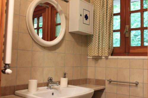 a bathroom with a sink and a mirror at CasaLalla - Natura&Relax in Cusano Mutri