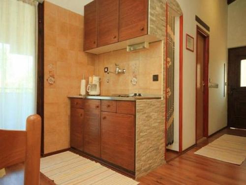 A kitchen or kitchenette at Apartment Dady with a large covered terrace