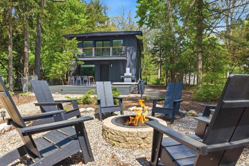 a group of chairs sitting around a fire pit at Sunset on Pokagon in Michiana