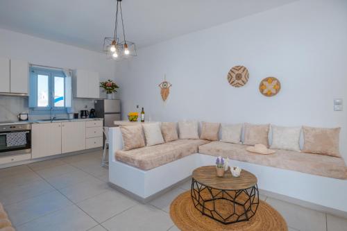a living room with a couch and a table at Begi Luxury Villas in Karterados