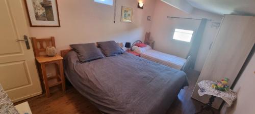 a bedroom with a large bed in a room at La Casa Liberta in Salavas