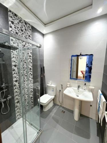 a bathroom with a toilet and a sink and a shower at Visit Chamal - Horizon View in Oued Laou