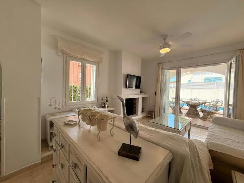 a living room with a bird statue on a table at Villa Riells Mar in L'Escala