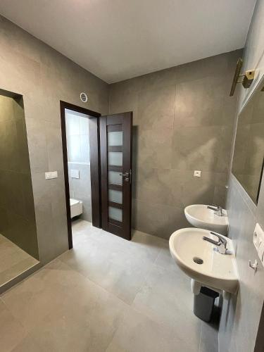 a bathroom with a sink and a toilet at Apartmán Bytča in Bytca