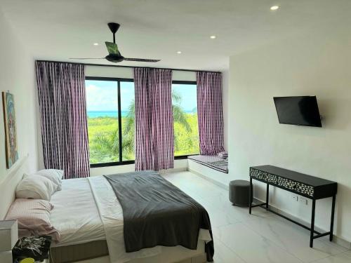 a bedroom with a bed and a large window at Villa Blanca only accessible by 4x4 vehicle in El Valle
