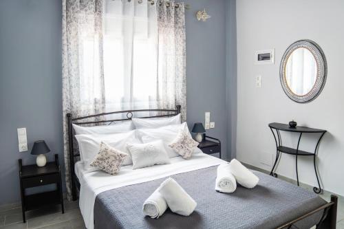 a bedroom with a bed with towels on it at Design studio Two in Palekastron