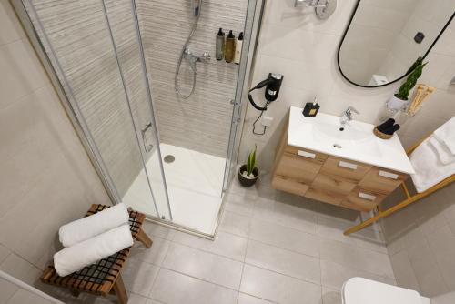 a bathroom with a shower and a sink at Zen Loft Quiet Retreat near St julians in Is-Swieqi