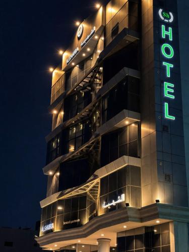 a building with a hotel sign at night at فندق الشهباء الفيحاء Hotel Al Shahba Al Faiha Jeddah in Jeddah