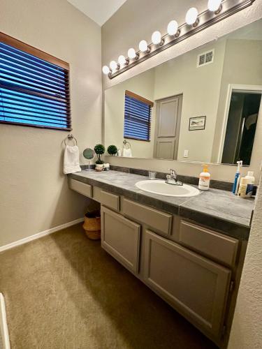 a bathroom with a sink and a mirror at Our Mountain View in Tucson