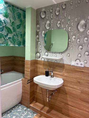 a bathroom with a sink and a mirror at Hard to leave in Piesport